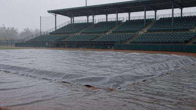 Double-A ballpark tarp after a rain cancellation