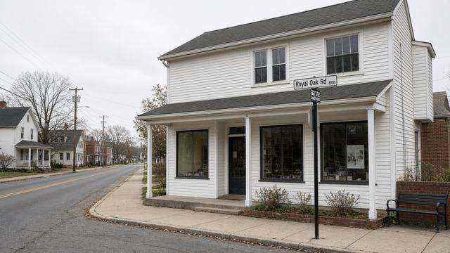 Village retail building on Royal Oak Road with an empty sidewalk