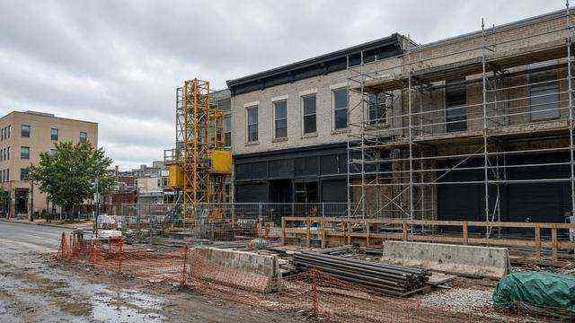Empty Maryland construction site beside a closed storefront