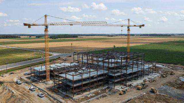 Hospital construction cranes over Longwoods Road fields