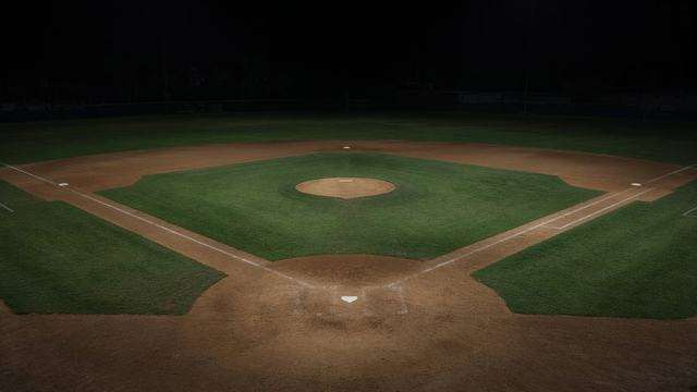Triple-A baseball diamond under night lights